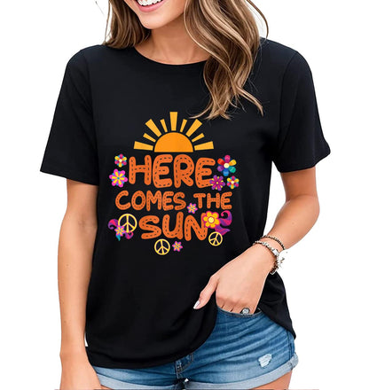 Welcome Sunshine with our "Here Comes The Sun" Hippie Flowers Graphic Shirt