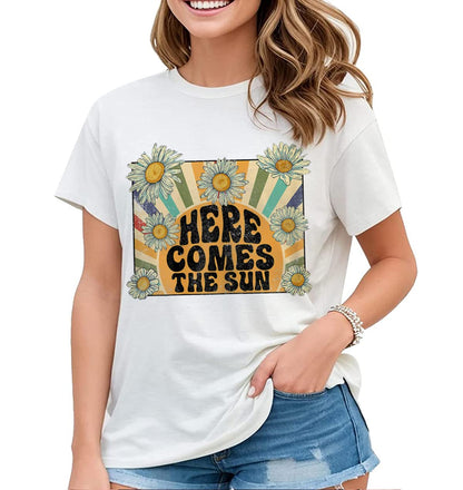 Welcome Sunshine with our "Here Comes The Sun" Hippie Flowers Graphic Shirt